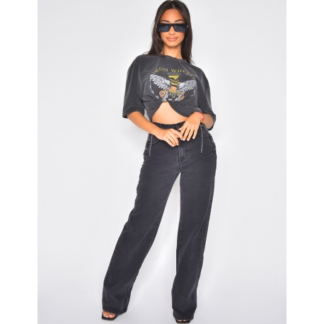 Jeans avec chaînes sur les hanches