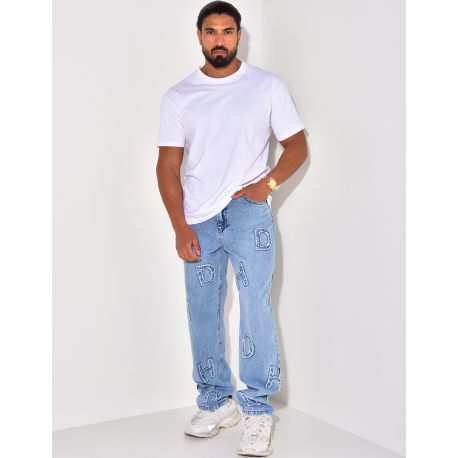 Jeans coupe large avec lettres en relief Jeans coupe large avec lettres en relief