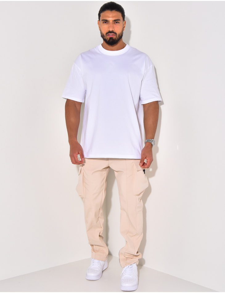 Pantalon à poches et fermeture éclaire aux chevilles Pantalon à poches et fermeture éclaire aux chevilles