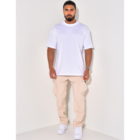 Pantalon à poches et fermeture éclaire aux chevilles Pantalon à poches et fermeture éclaire aux chevilles