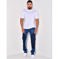 Jeans à poches avec empiècements et tâches de peinture Jeans à poches avec empiècements et tâches de peinture