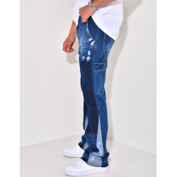 Jeans à poches avec empiècements et tâches de peinture Jeans à poches avec empiècements et tâches de peinture