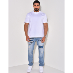 Jeans destroy à tâches de peinture et écritures Jeans destroy à tâches de peinture et écritures