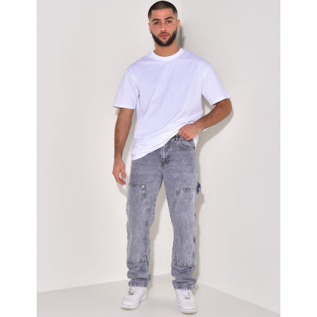 Jeans avec empiècements à motifs en relief