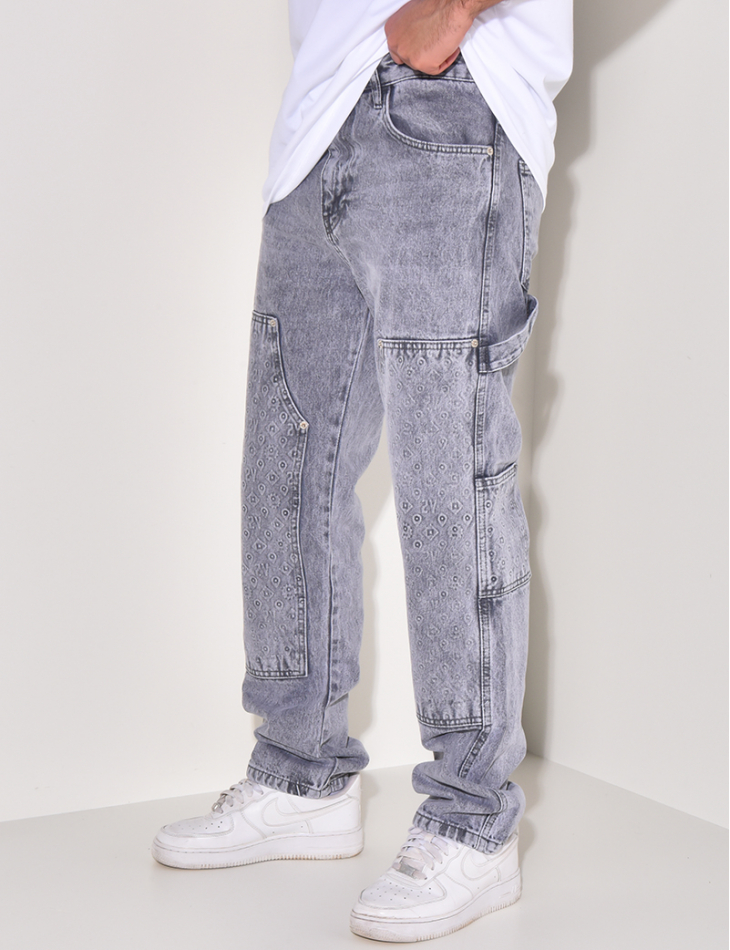 Jeans avec empiècements à motifs en relief