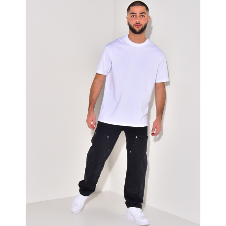 Jeans avec empiècements à motifs en relief