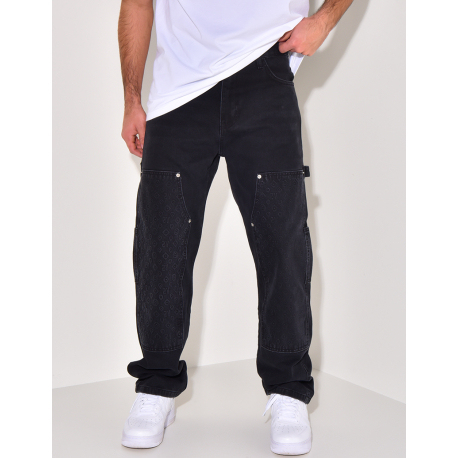 Jeans avec empiècements à motifs en relief