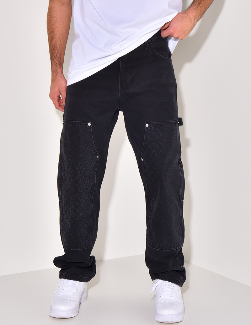 Jeans avec empiècements à motifs en relief