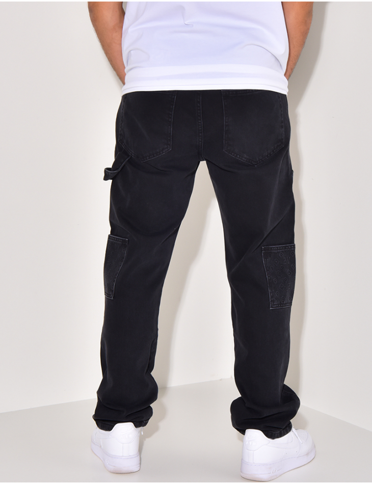 Jeans avec empiècements à motifs en relief