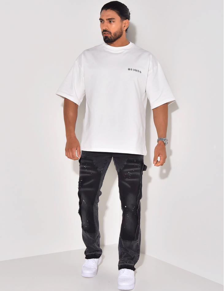 Jeans à empiècements et tâches de peinture Jeans à empiècements et tâches de peinture