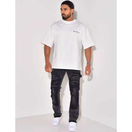 Jeans à empiècements et tâches de peinture Jeans à empiècements et tâches de peinture