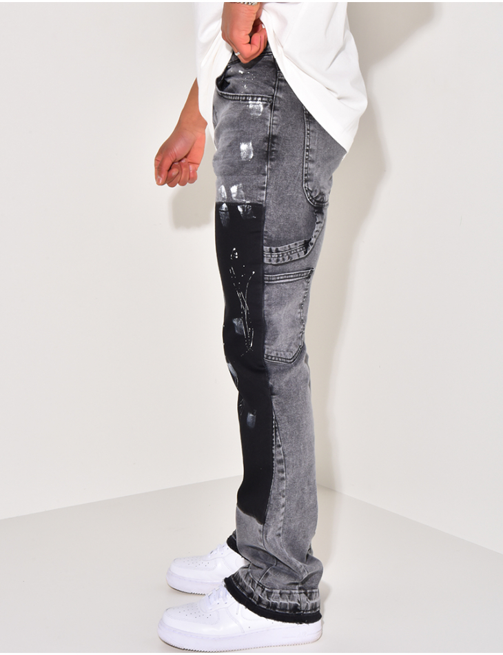 Jeans with panels and stains