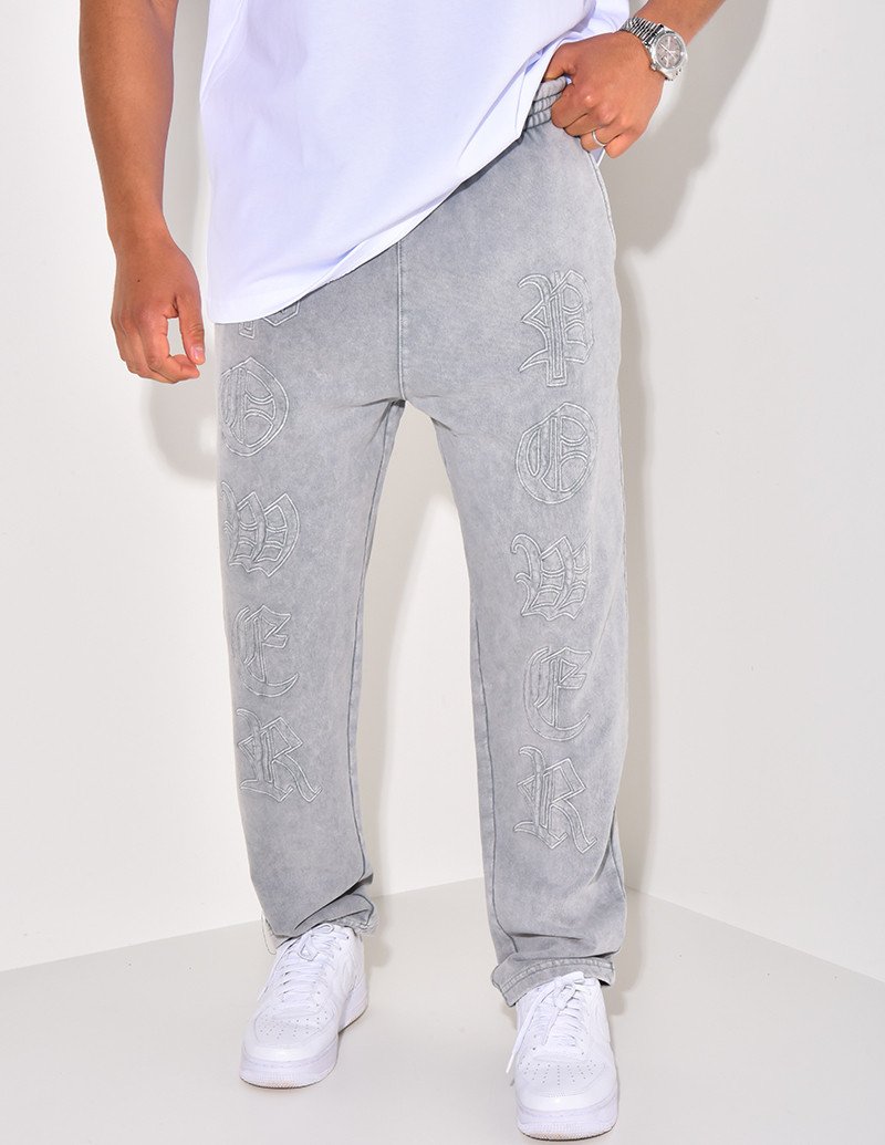 Pantalon de jogging à écriture aspect vieilli