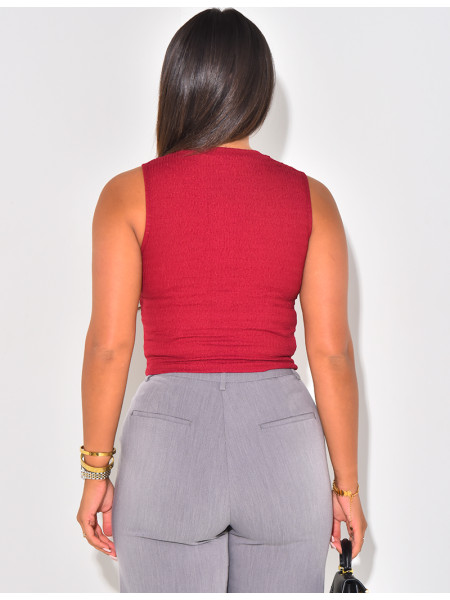 Sleeveless button-down top