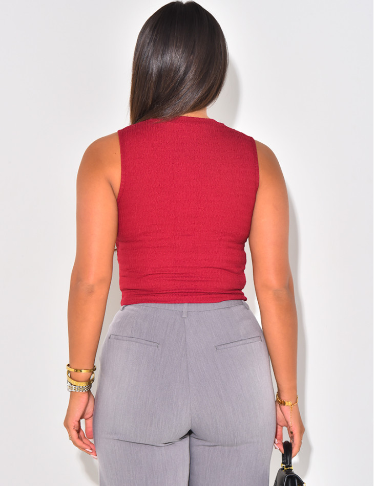 Sleeveless button-down top