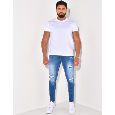 Jeans à tâches de peinture et chaînes
