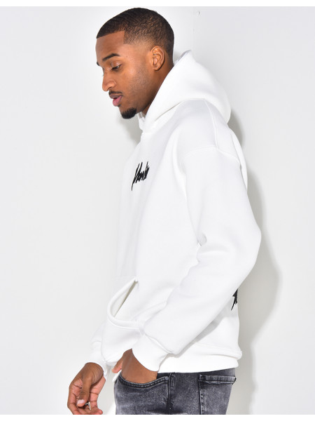 Sweat à capuche avec dessin dans le dos