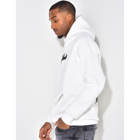 Sweat à capuche avec dessin dans le dos