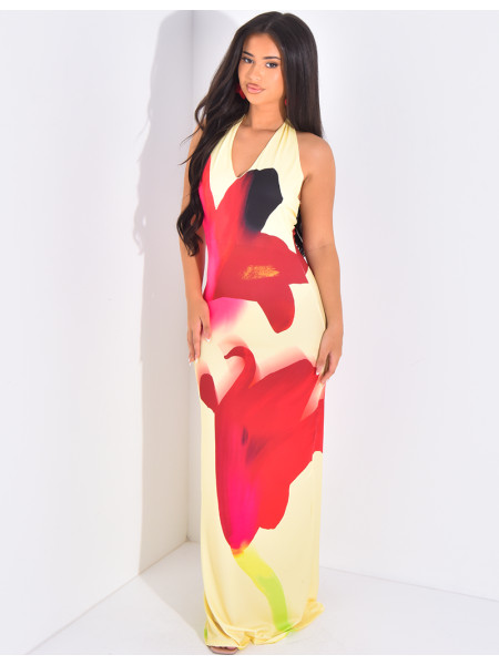 Langes, eng anliegendes, rückenfreies Kleid mit bedruckten Blumen.