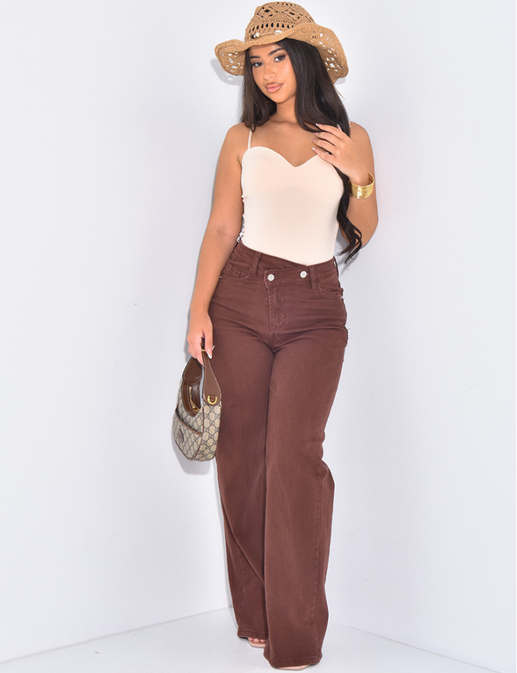 Brown straight-leg jeans with asymmetric buttonhole