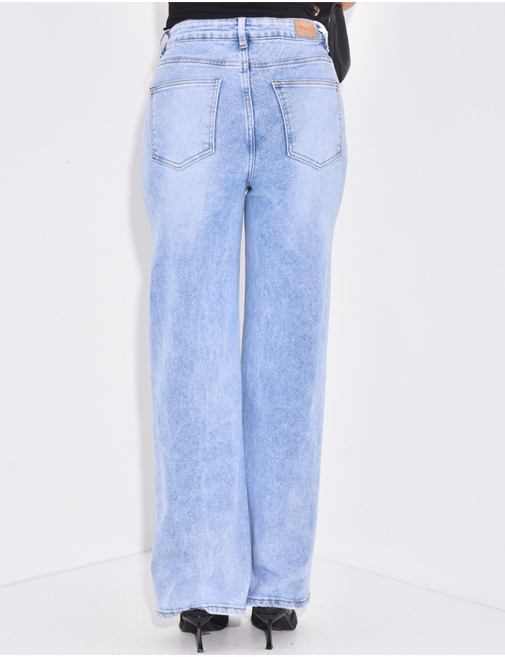 Jeans coupe droite délavé à boutonnière asymétrique