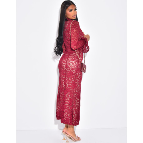 Long, form-fitting lace dress with high neck