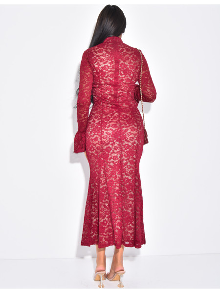 Long, form-fitting lace dress with high neck