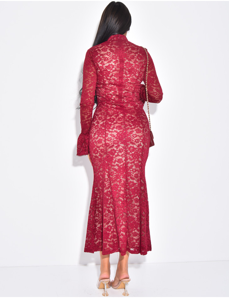 Long, form-fitting lace dress with high neck