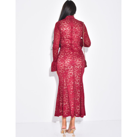Long, form-fitting lace dress with high neck
