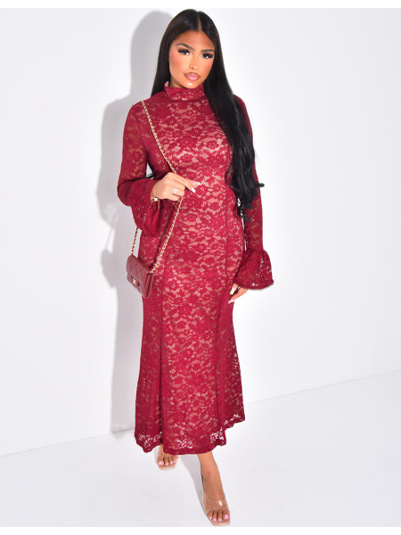Long, form-fitting lace dress with high neck