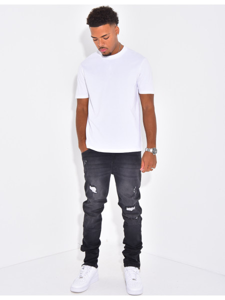 Jeans à fermeture éclaire et tâches