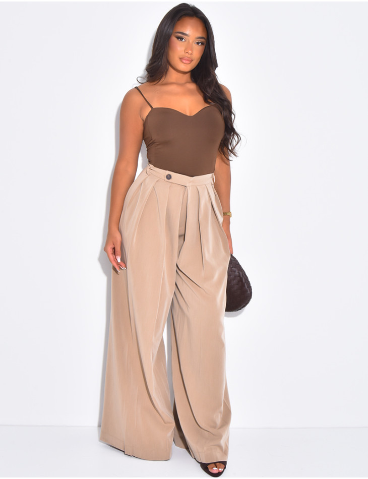 Pleated tailored trousers with a puffed effect