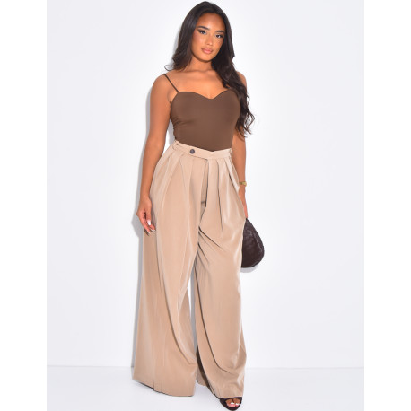 Pleated tailored trousers with a puffed effect