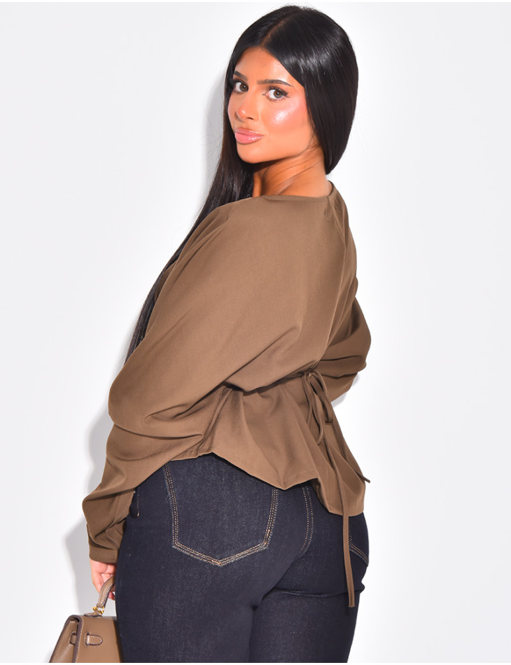 Long-sleeved blouse, fitted at the waist with a bow at the back