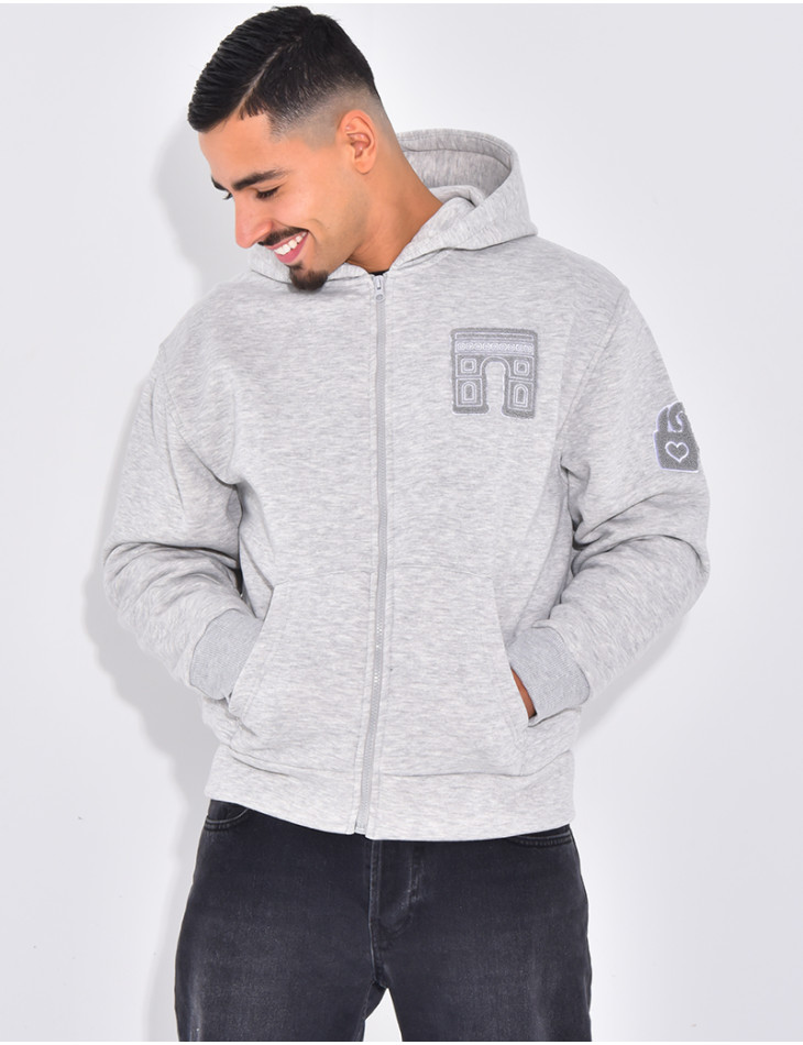 Veste à capuche avec arc de triomphe