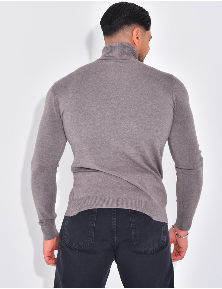 Long-sleeved turtleneck sweater.