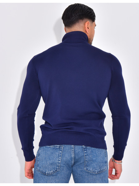 Long-sleeved turtleneck sweater.