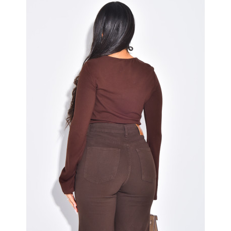 Fitted top with openwork effect at the neckline and flared sleeves