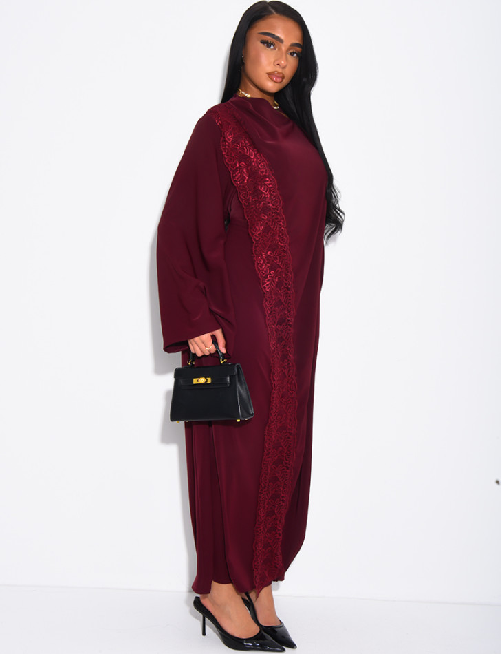 Long dress with a cape featuring lace panels