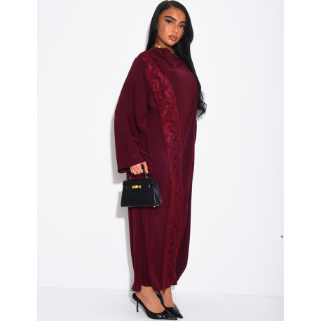 Long dress with a cape featuring lace panels