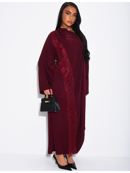 Long dress with a cape featuring lace panels