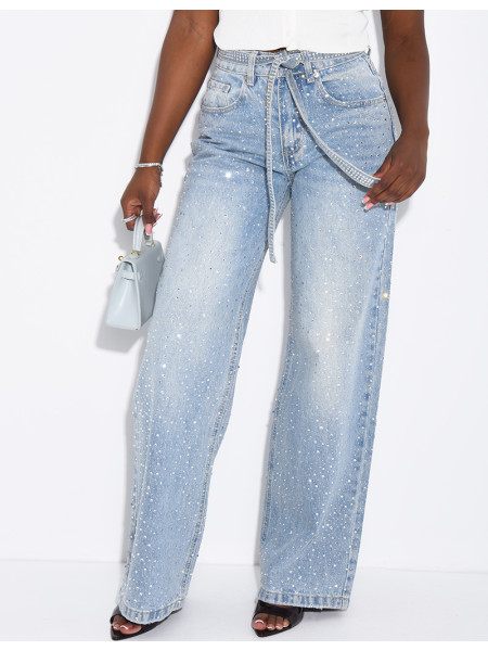 Wide-leg jeans covered in rhinestones with a matching belt