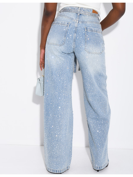 Wide-leg jeans covered in rhinestones with a matching belt