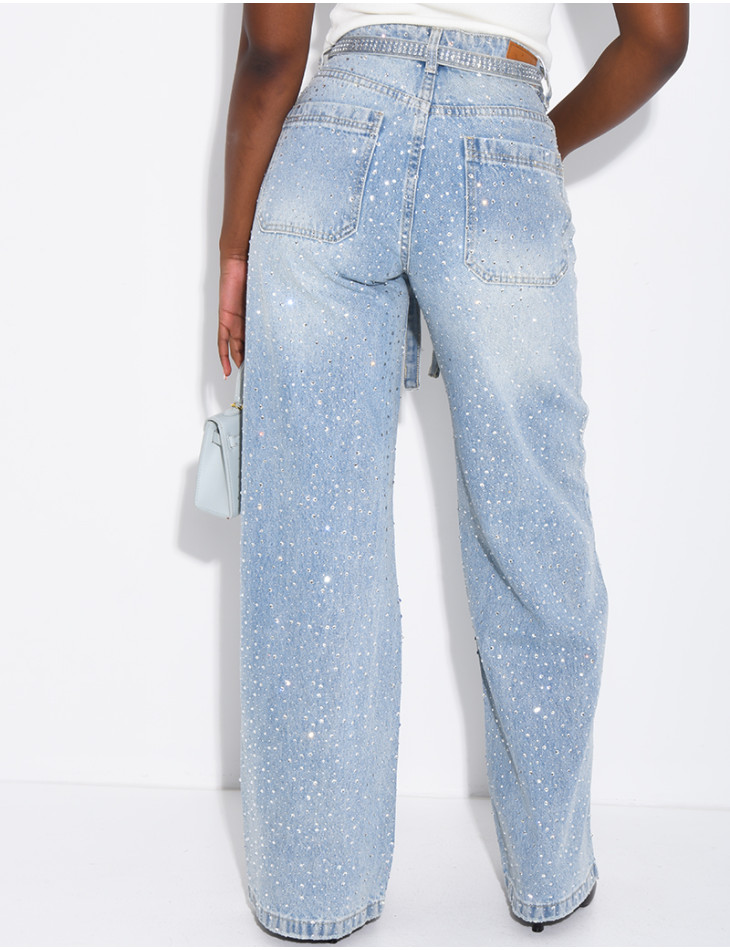 Wide-leg jeans covered in rhinestones with a matching belt