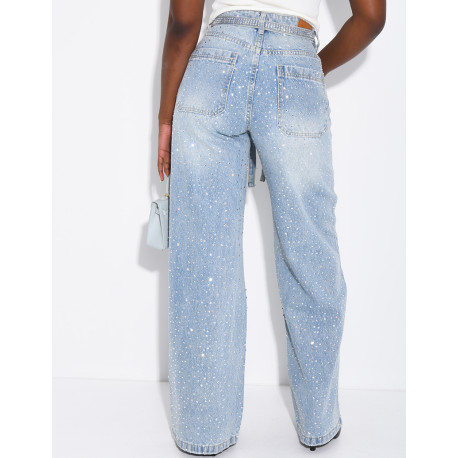 Wide-leg jeans covered in rhinestones with a matching belt