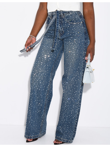 Wide-leg jeans covered in rhinestones with a matching belt