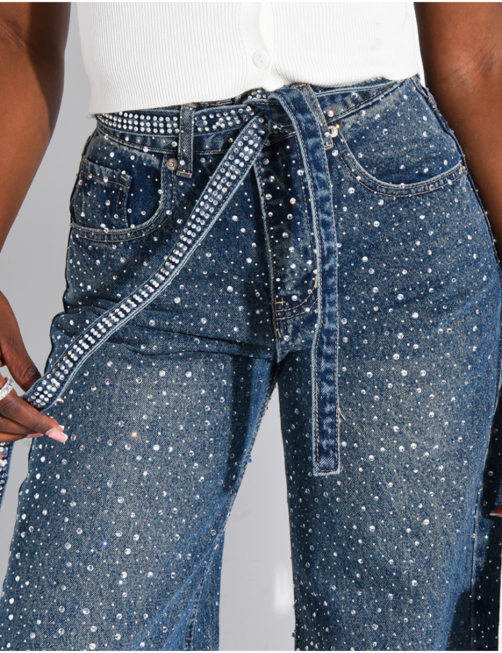Wide-leg jeans covered in rhinestones with a matching belt