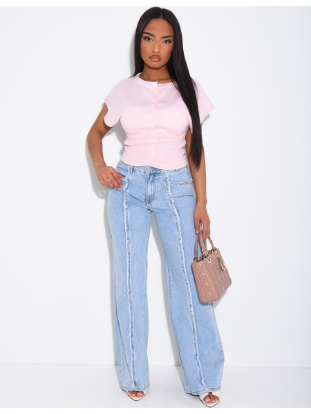 Jeans with frayed seams and studs on the pockets