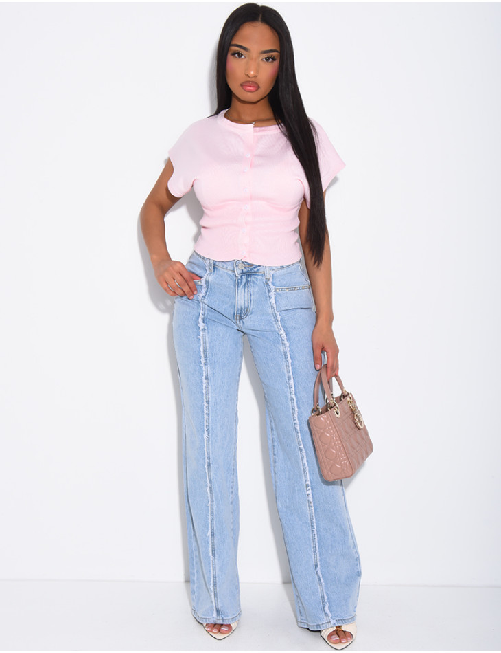 Jeans with frayed seams and studs on the pockets