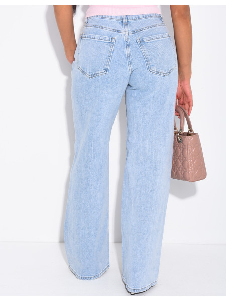 Jeans with frayed seams and studs on the pockets